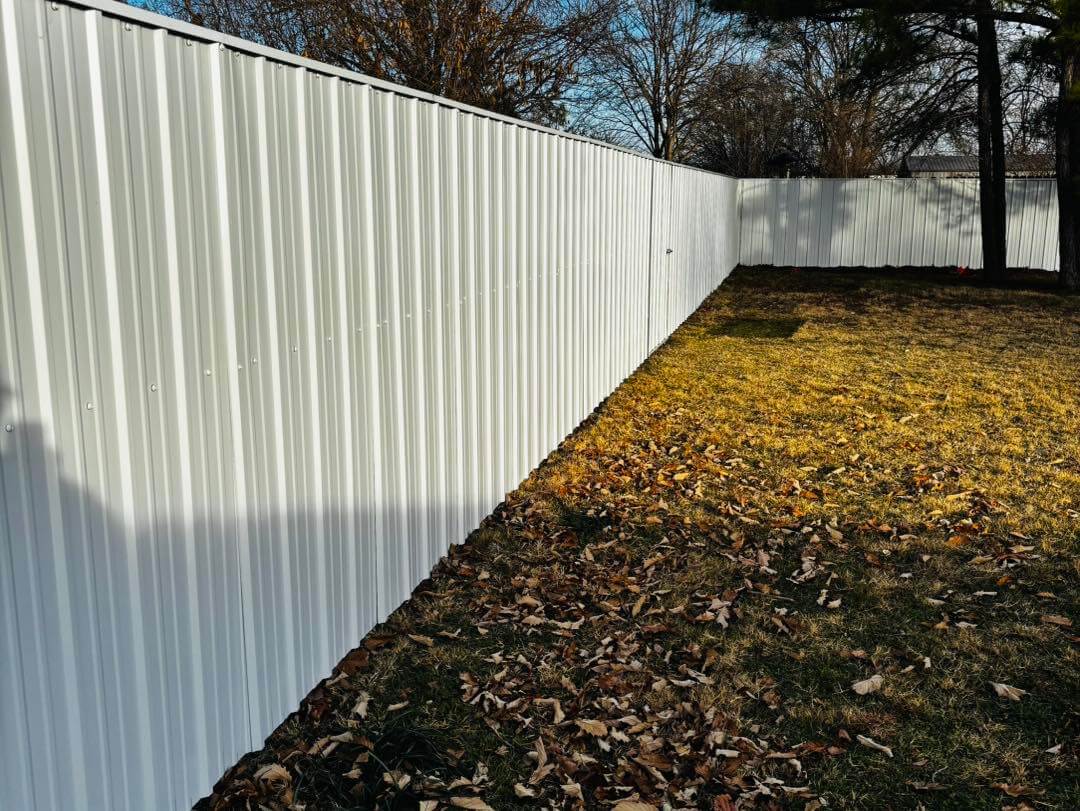 Metal fence installation by KB Fence & Construction